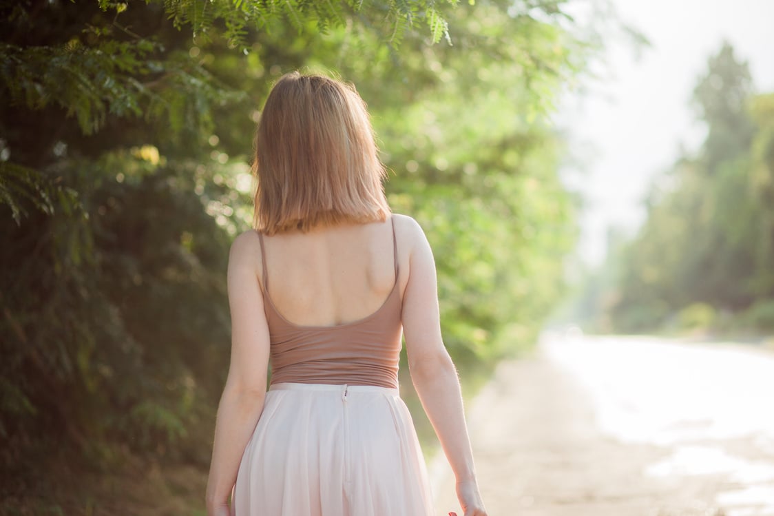 Back View of Short-Haired Woman in Brown Top